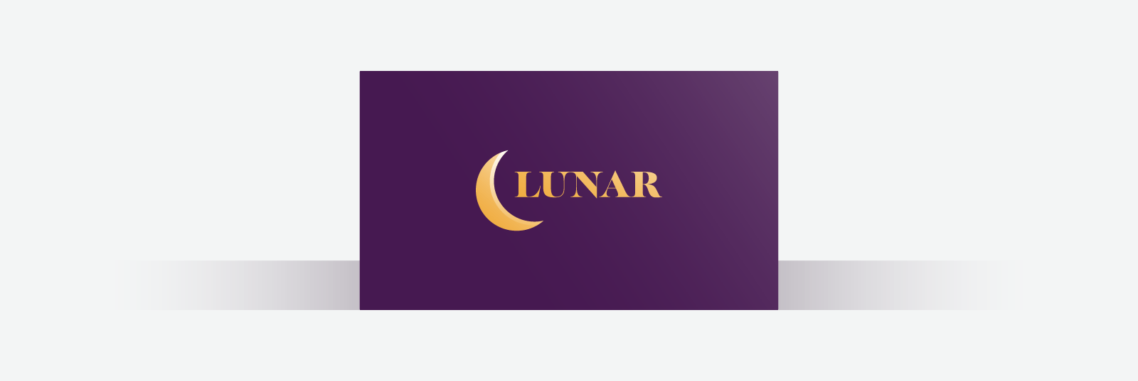 Dark purple business card with gold font and crescent moon