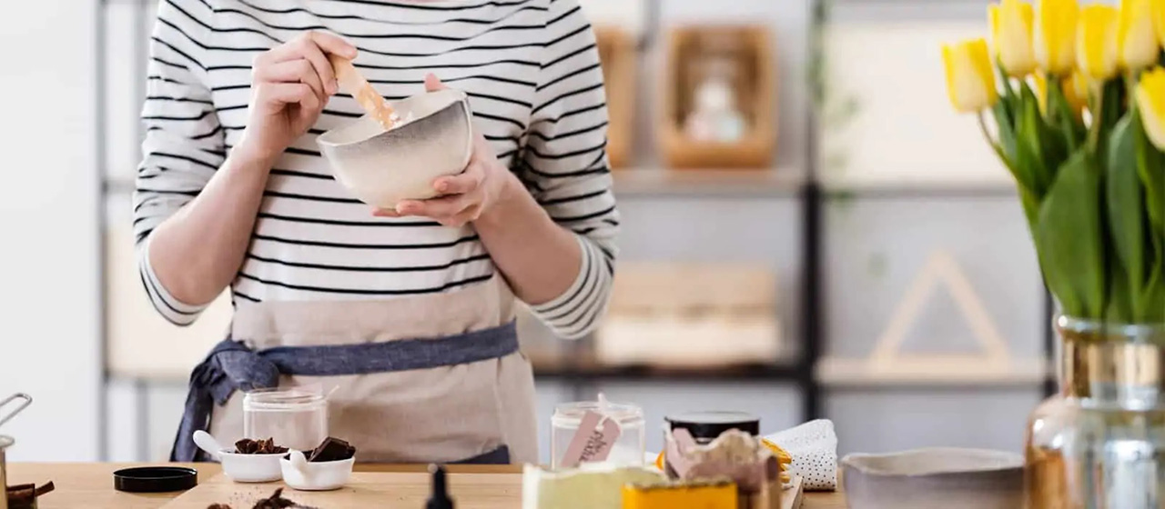 Person mixing ingredients in bowl